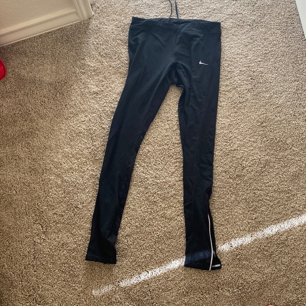 Black Nike running leggings. Size S
